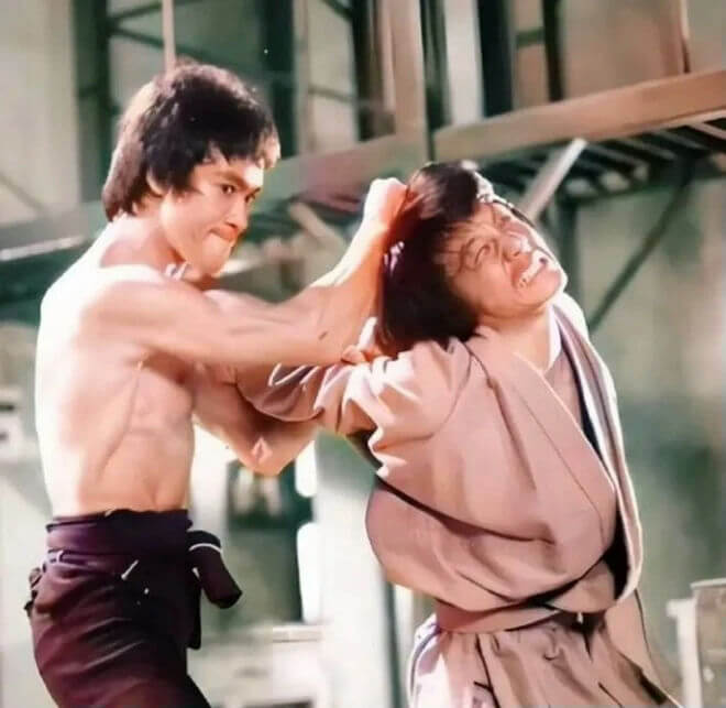 people-Bruce Lee-A-Jackie Chan-A-fighting scene-B-grabbing hair-C-intense expression