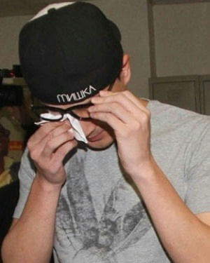 people-man-Wiping glasses-A-Black cap-B-Grey t-shirt-C-Emotional distress