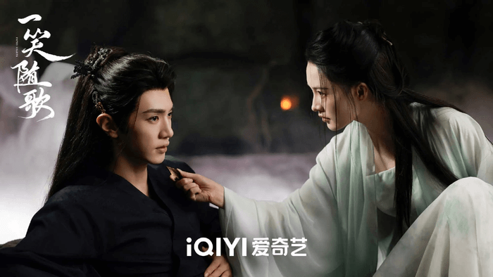 people-man in black robes-A-woman in light green robes-B-intense gaze-C-offering/receiving object