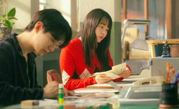 people-man-working-woman-reading-desk-office