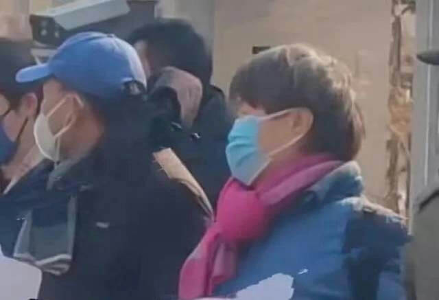 people-2-face masks-person in blue cap-person with pink scarf-outdoor setting