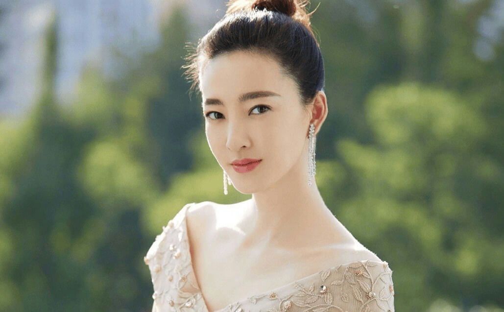 people-woman-elegant-off-the-shoulder-gown-diamond-earrings-outdoor-portrait