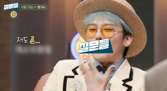 people-G-Dragon-A-straw hat-A-sunglasses-A-light blue hair-A-beige suit