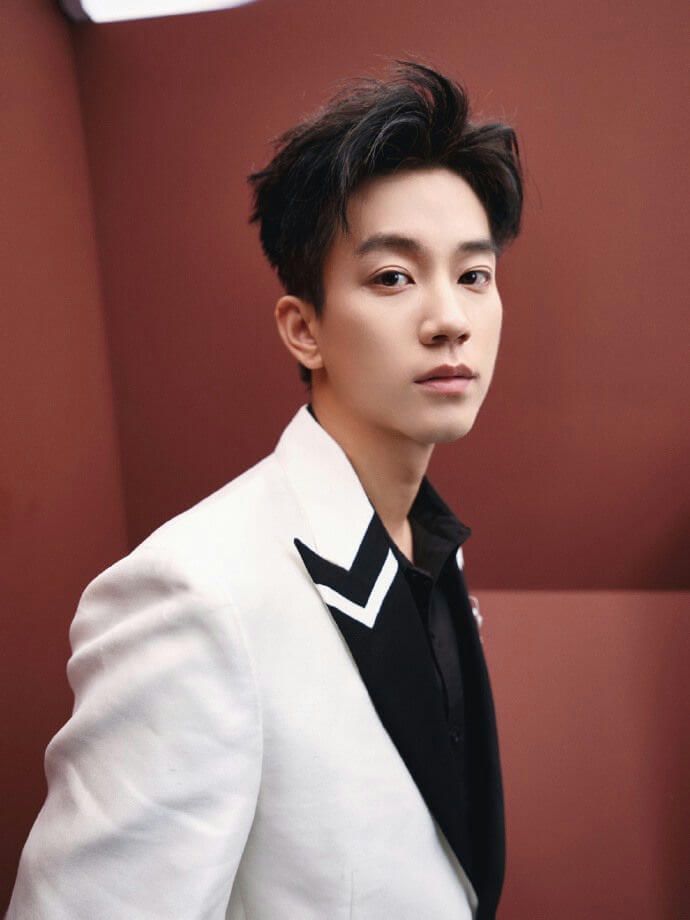 people-male-A-handsome-A-white blazer-A-black shirt-B-standing against red background-C