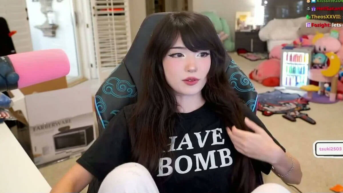 people-1-woman-A-long dark hair-A-wearing a black t-shirt-B-sitting in a gaming chair-C