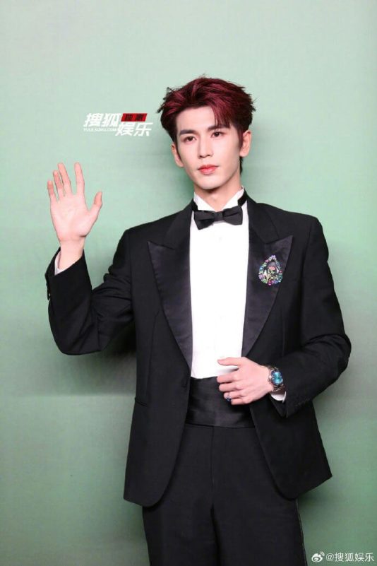 people-man-A-tuxedo-A-red hair-A-waving-A-brooch