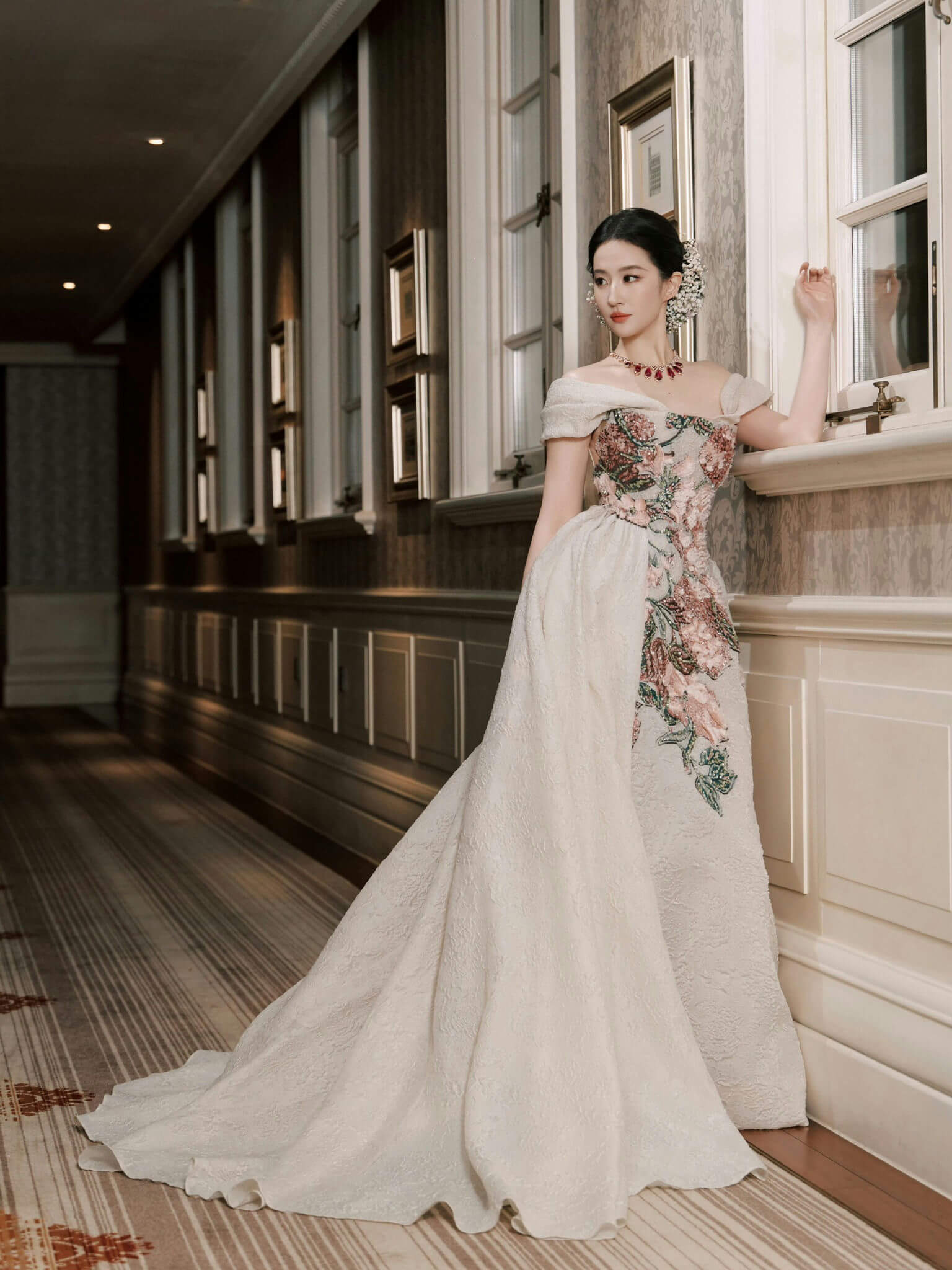 people-woman-A-elegant gown-B-floral embroidery-C-interior hallway