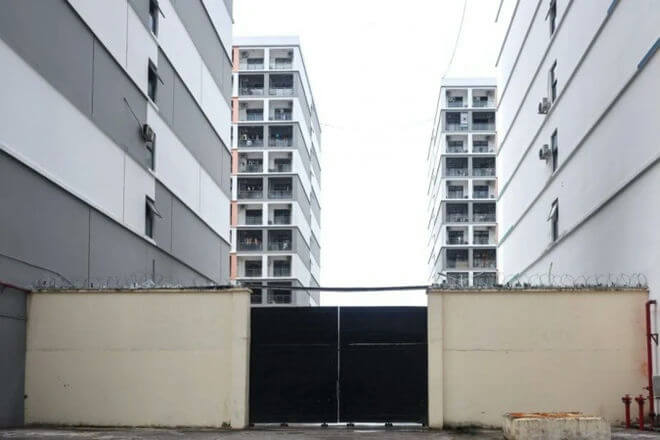 people-0-gated-A-apartment-buildings-A-razor-wire-A-concrete-wall