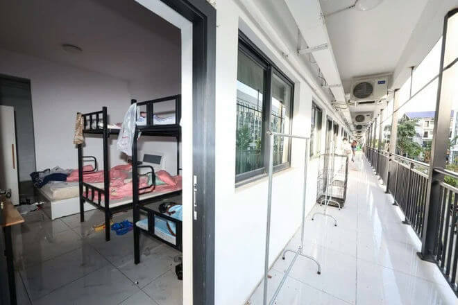 people-0-dormitory-A-bunk beds-A-hallway-B-air conditioners-B-clothes racks-C
