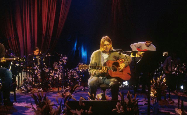 people-Kurt Cobain-performing-A-acoustic guitar-A-seated-A-cardigan-B-Dave Grohl-C-Pat Smear