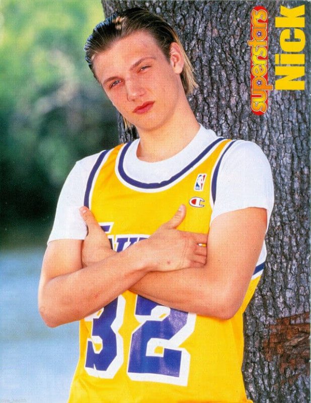 people-Nick Carter-A-yellow basketball jersey-B-leaning against a tree-C-90s style idol