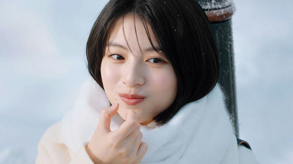 people-woman-A-winter-A-snow-A-white scarf-A-dark hair-A-close-up