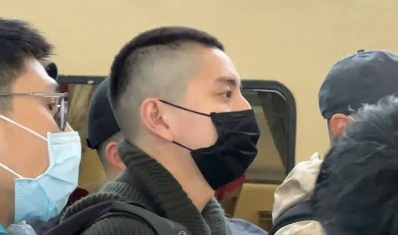 people-1-man-A-side-profile-A-black-face-mask-A-undercut-hairstyle