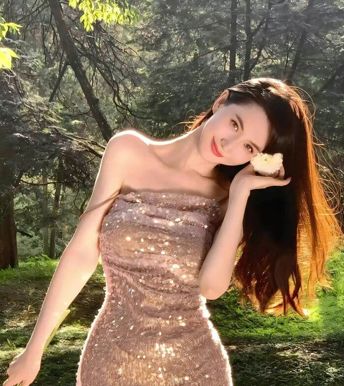people-woman-A-sequined-dress-A-forest-setting-A-holding-flower-B-backlit