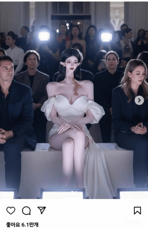 people-Woman in white dress with elf-like features and long dark hair-Woman in white off-shoulder dress-Elf-like features-Uncanny valley-Audience at a fashion show