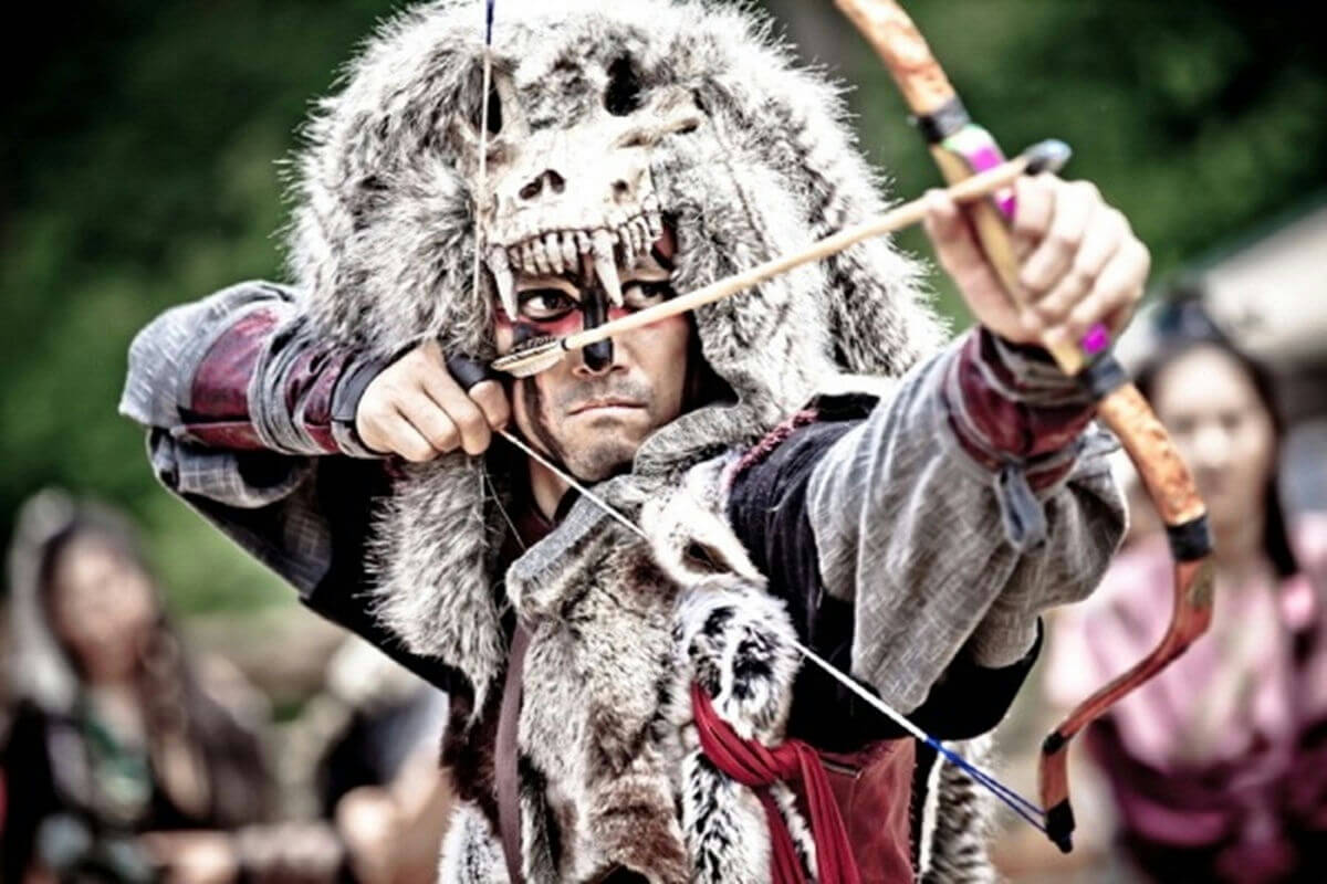 people-1-archer-A-wolf-hood-A-face-paint-B-bow-and-arrow-C
