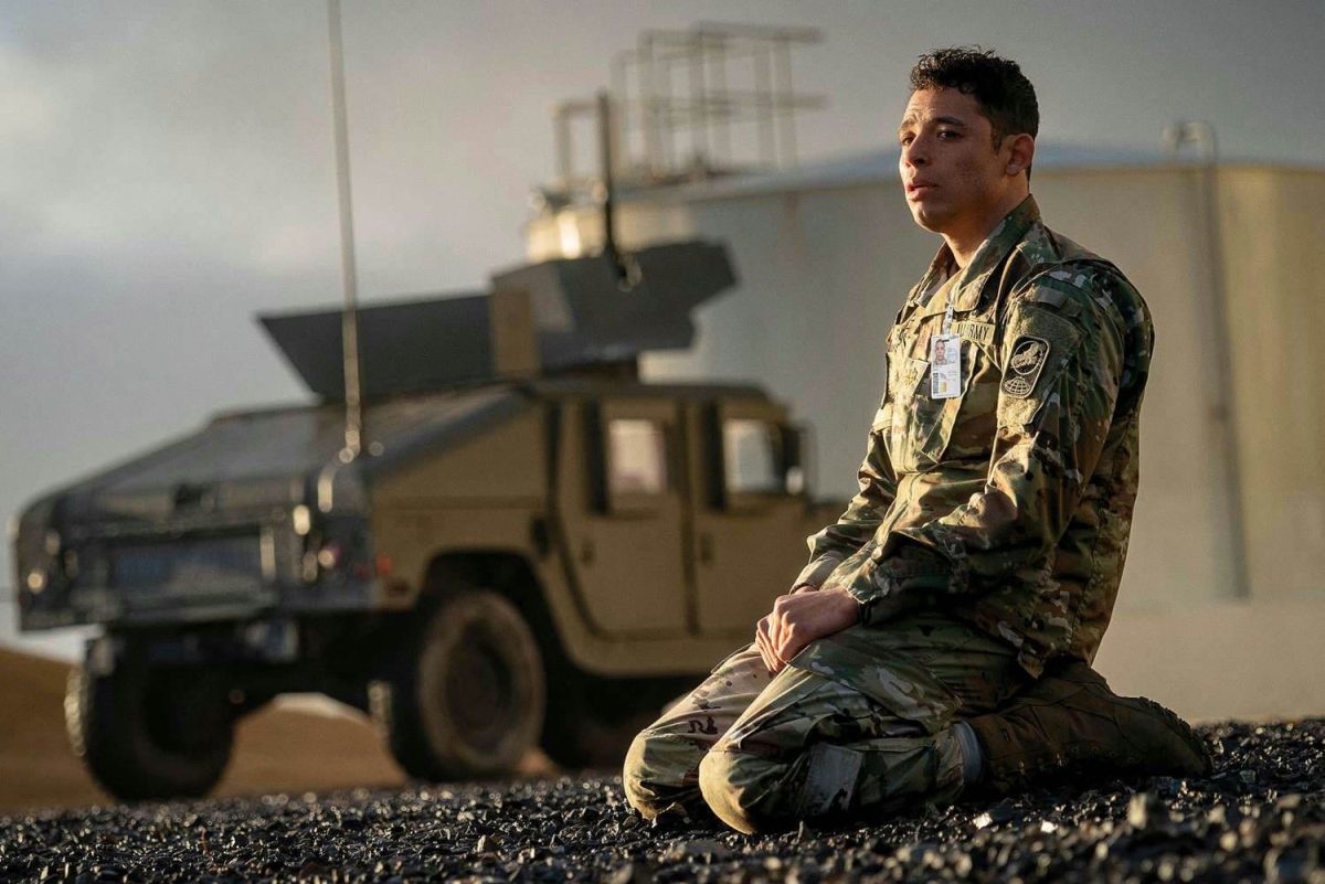 people-A-soldier-A-kneeling-B-military-vehicle-C-outdoor