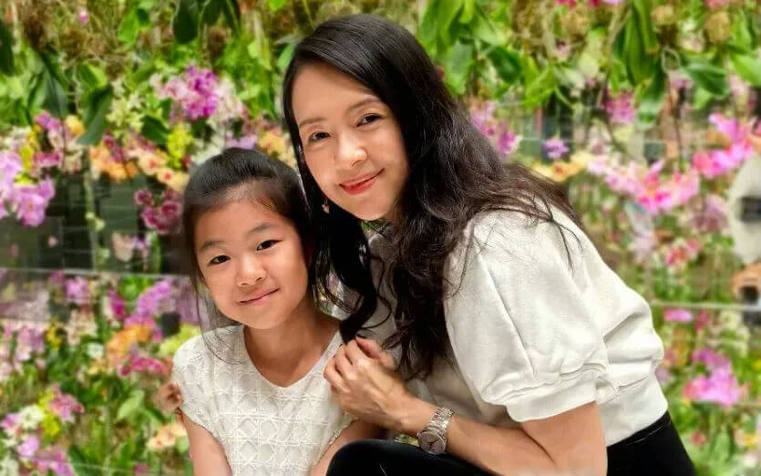 people-Mother and Daughter-smiling-indoors-floral background-casual wear-Asian descent