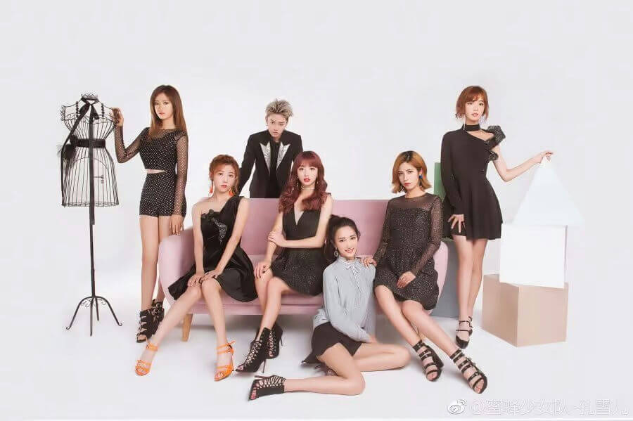 people-7-Asian-A-group-A-fashion-A-posing-A-studio-A-black-dress-A-pink-sofa