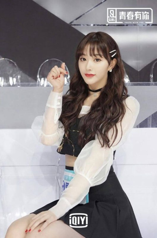 people-A-woman-A-idol-A-youth with you logo-B-black and white outfit-B-finger heart gesture