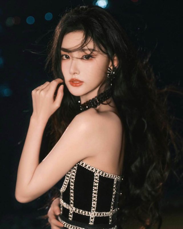people-woman-A-long black hair-B-strapless embellished top-C-night outdoor setting