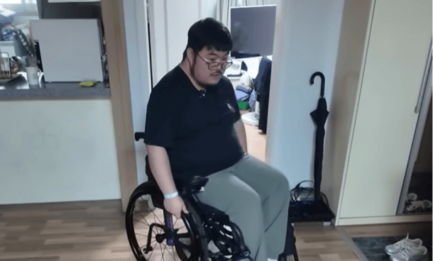 people-1-man-A-wheelchair-A-folding-A-indoor
