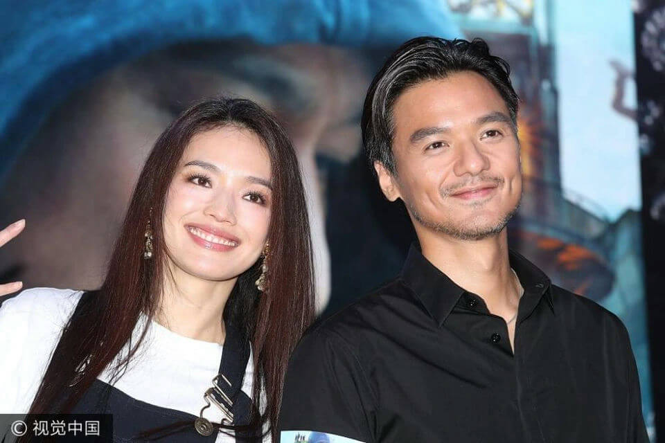 people-Shu Qi and Daniel Wu-smiling-long dark hair-black collared shirt-dimples