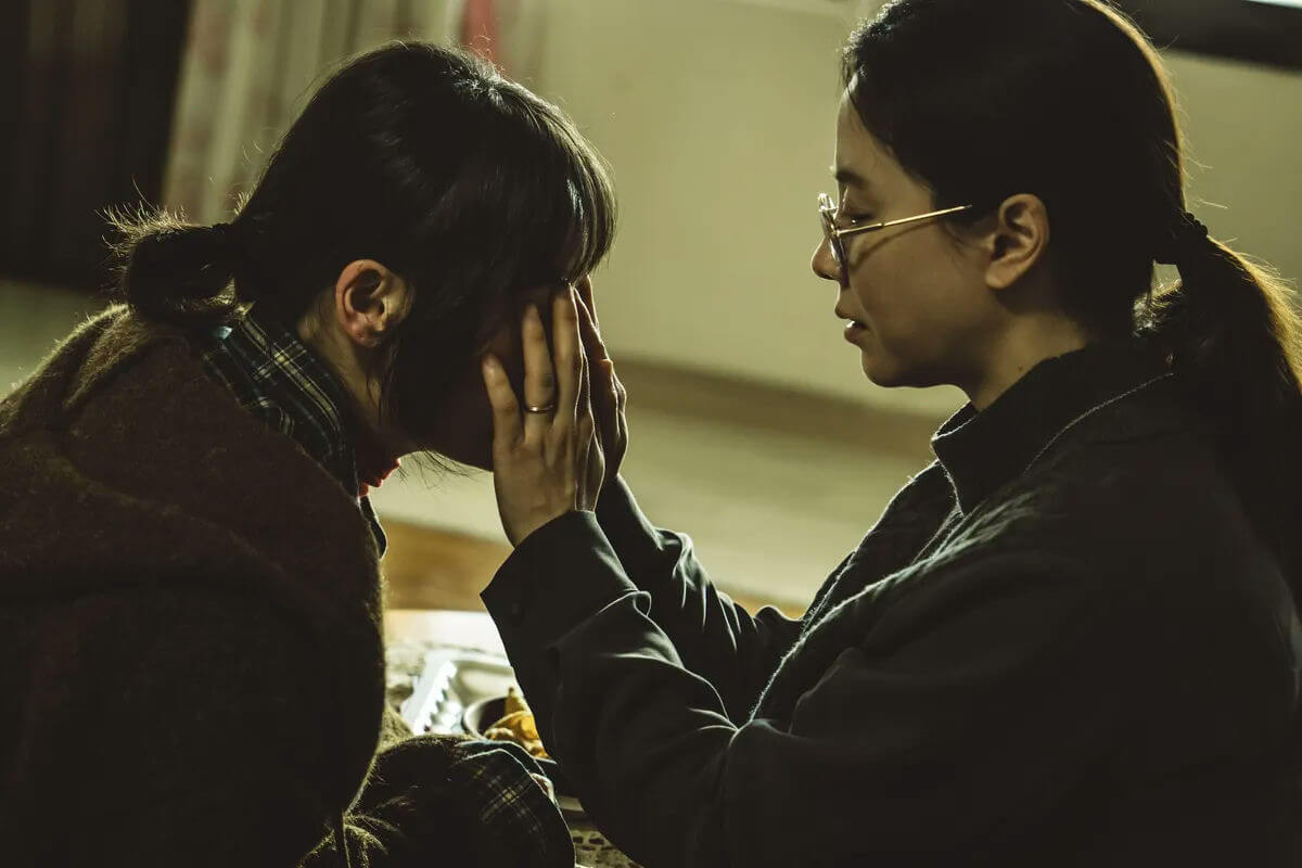 people-Two women-A-Comforting-A-Distress-B-Glasses-B-Ring-C-Dark lighting