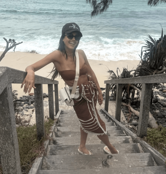 people-1-woman-A-beachwear-A-stairs-A-ocean