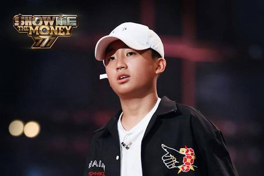 people-young male rapper-A-white baseball cap-B-black jacket with embroidery-C-Show Me The Money 777 logo