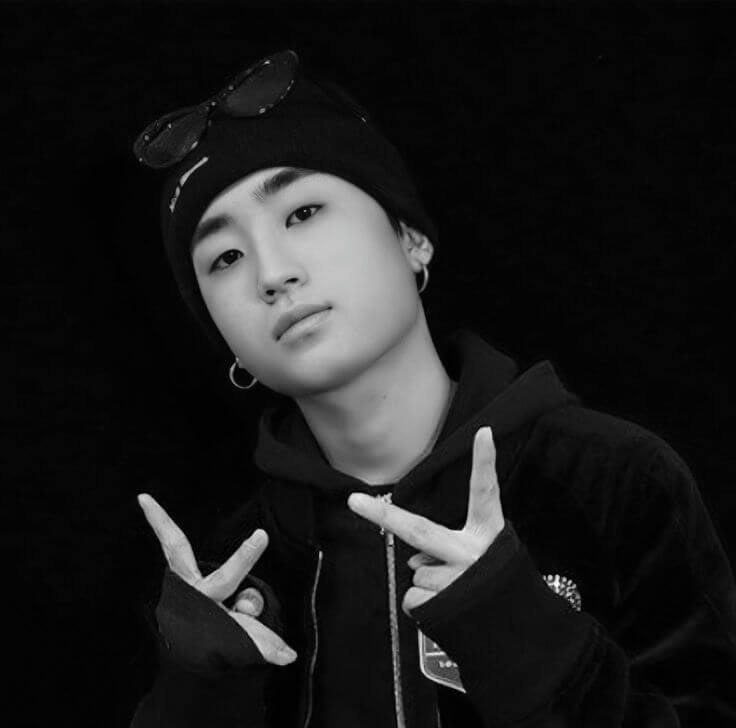 people-young man-A-black and white-A-beanie-A-peace sign-B-hoodie-C