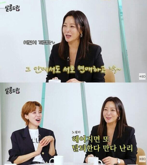 people-woman in black blazer with long dark hair talking-Korean text-woman with short blonde hair listening and reacting-Korean text-two women seated at a table in a brightly lit studio setting