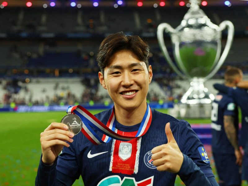 people-Asian man-A-soccer player-A-smiling-A-holding medal-B-giving thumbs up-C