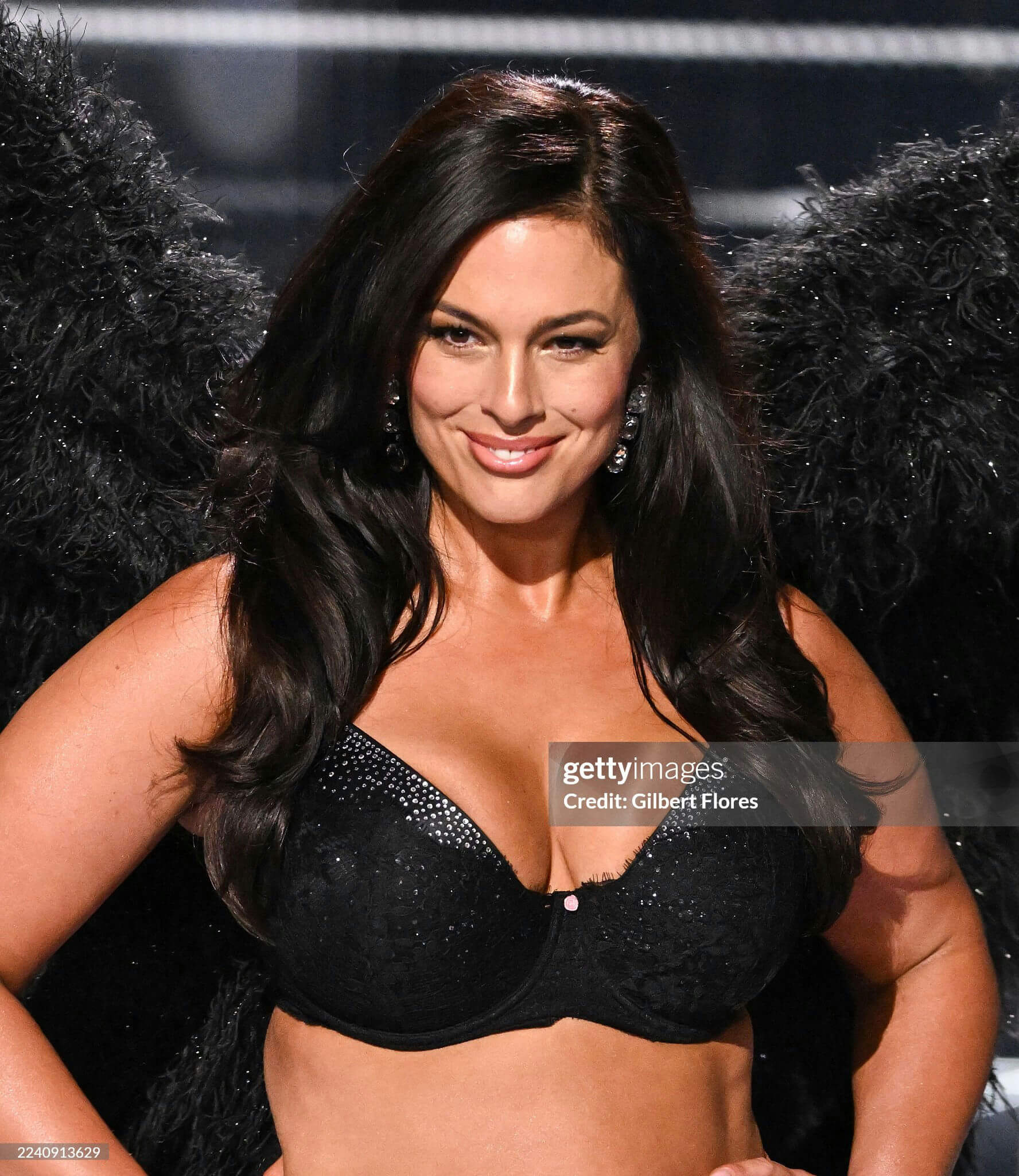 people-Ashley Graham-model-black lingerie-feathery wings-smiling