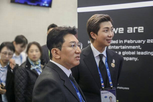 people-RM (BTS)-suit-Bang Si-hyuk-glasses-delegates-event backdrop