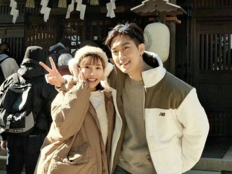 people-A-couple-A-smiling-A-peace-sign-B-earmuffs-B-winter-jacket-C-New-Balance-jacket-C