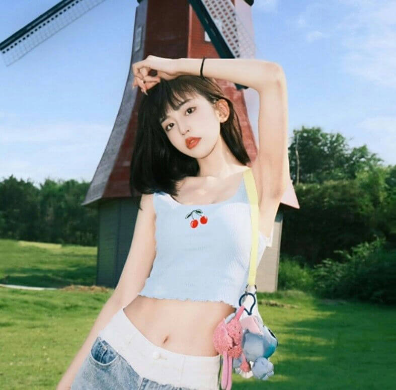 people-1-Asian female-A-dark hair-A-light blue cherry crop top-B-denim shorts-C-windmill background