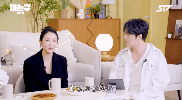 people-two people-A-sitting-A-interview setting-B-woman in black blazer-C-man in white jacket