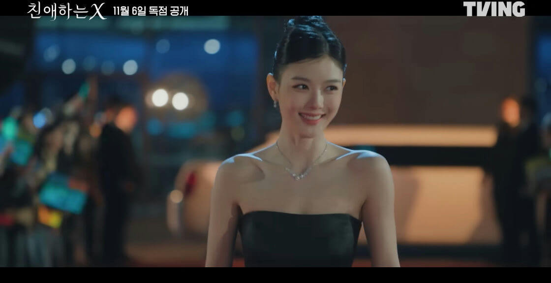 people-woman-A-smiling-B-black strapless dress-C-jewelry