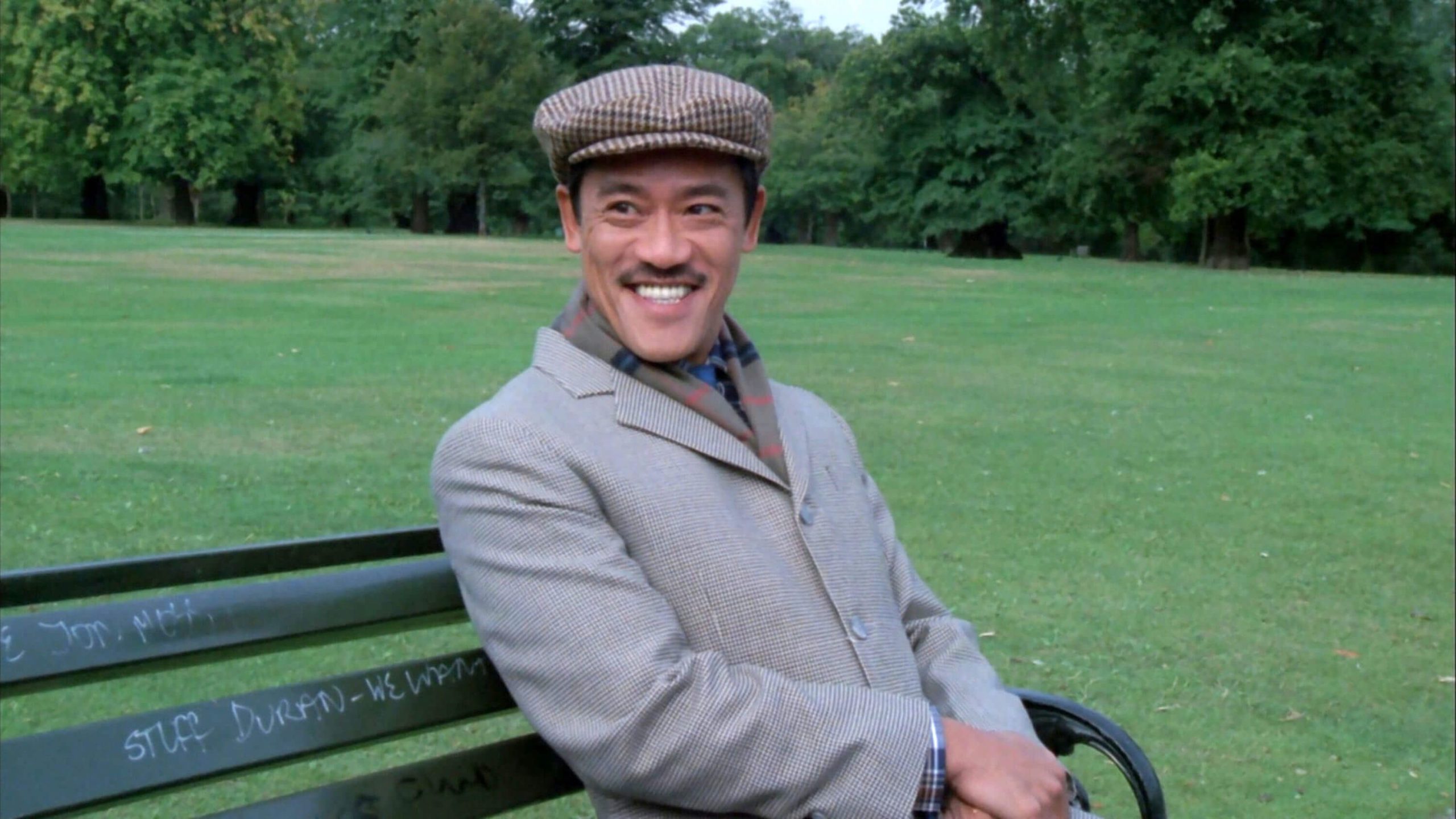 people-Man-A-smiling-A-wearing-a-flat-cap-A-sitting-on-a-park-bench