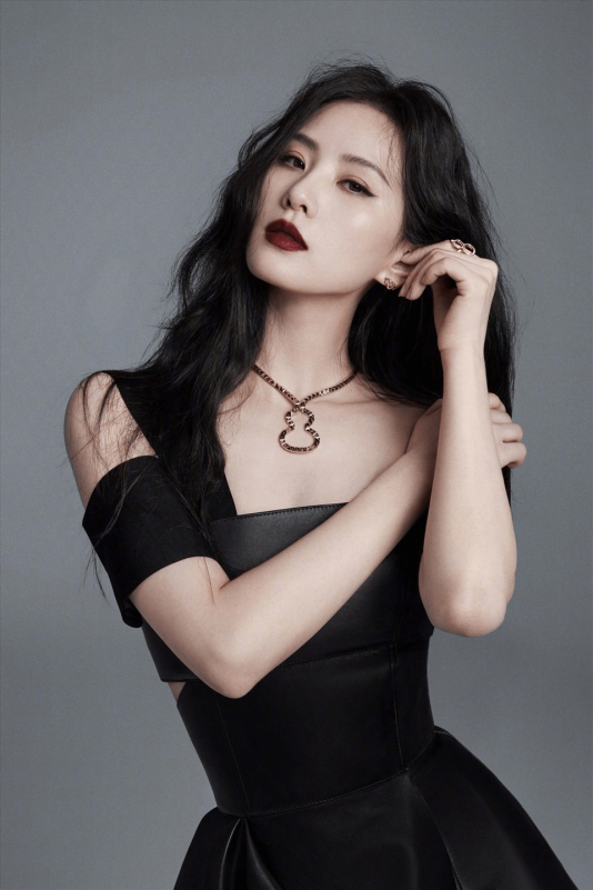 people-female-Asian-A-dark hair-B-black leather outfit-C-gourd necklace