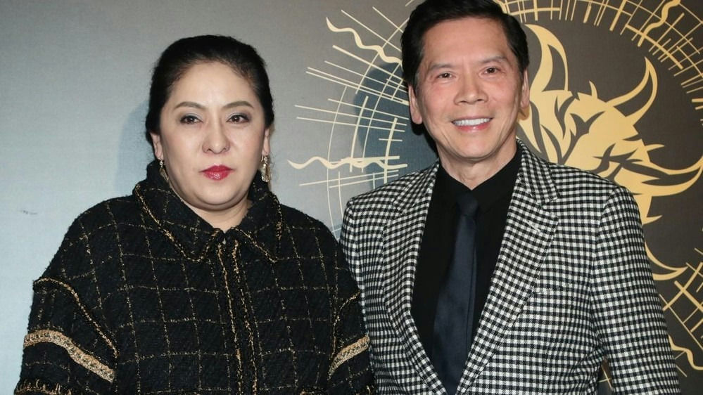 people-two people-A-couple-A-man and woman-A-formal attire-A-black and white checkered jacket-A-tweed jacket