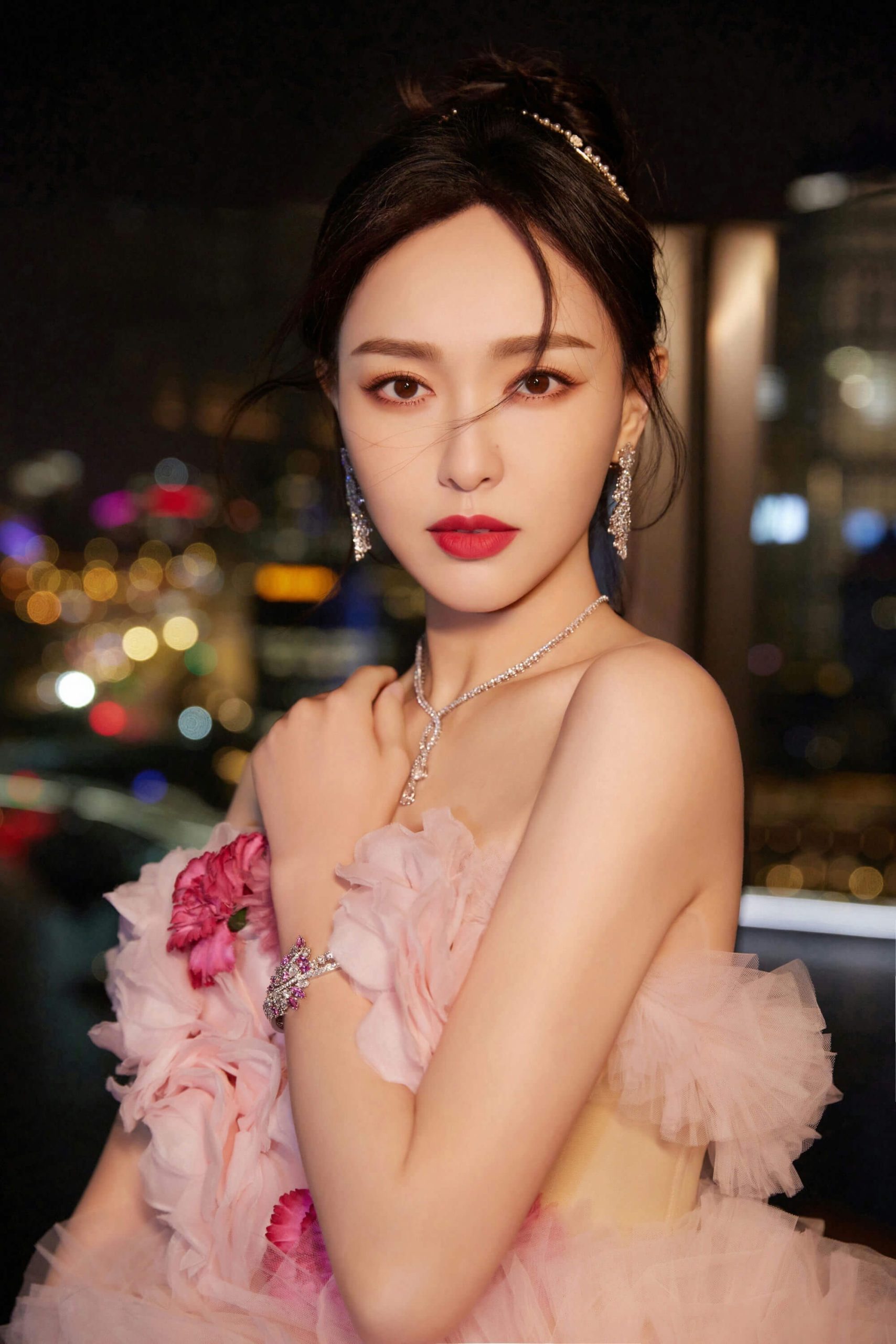 people-woman-A-formal attire-B-jewelry-C-nighttime city background