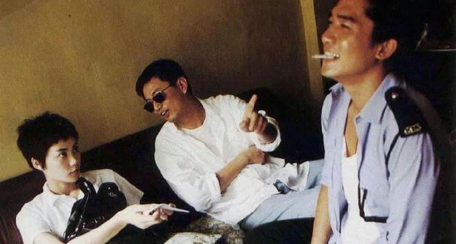people-3-men-Asian-woman-sitting-on-couch-indoor-wearing-white-shirt-sunglasses-police-uniform-smoking