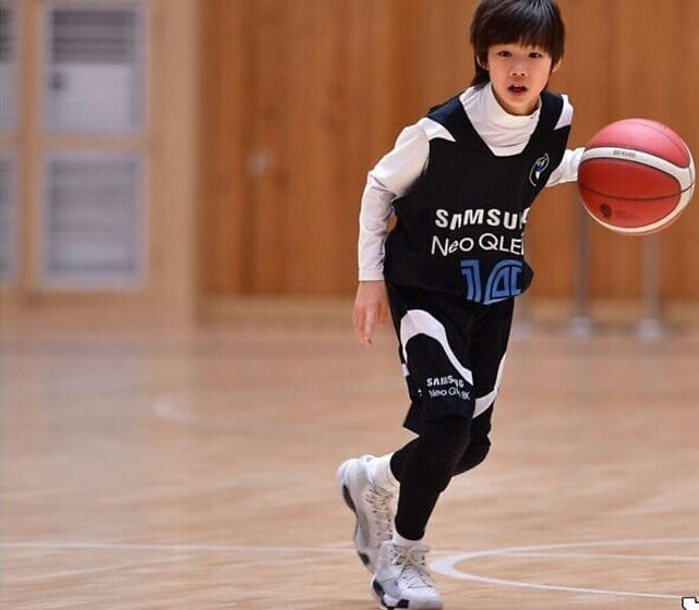 people-A-young-boy-A-basketball-player-A-dribbling-A-indoor-court