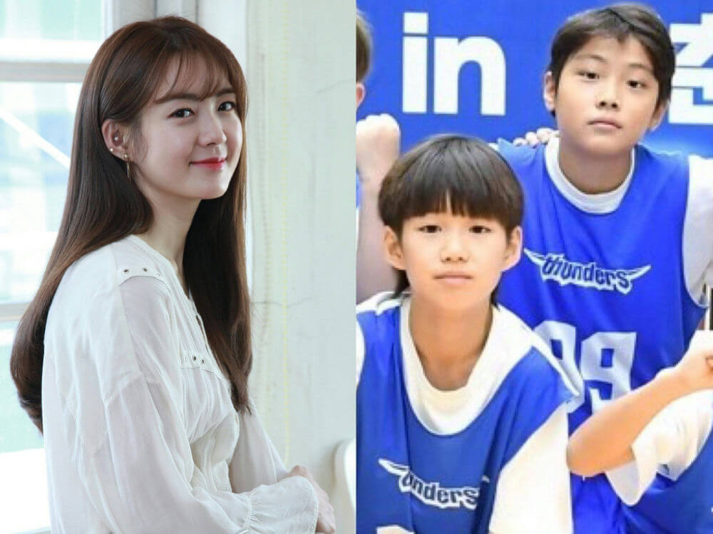 people-Woman-Smiling-Long brown hair-White sheer top-A-Two boys-Blue basketball jerseys-Thunders logo-B-C