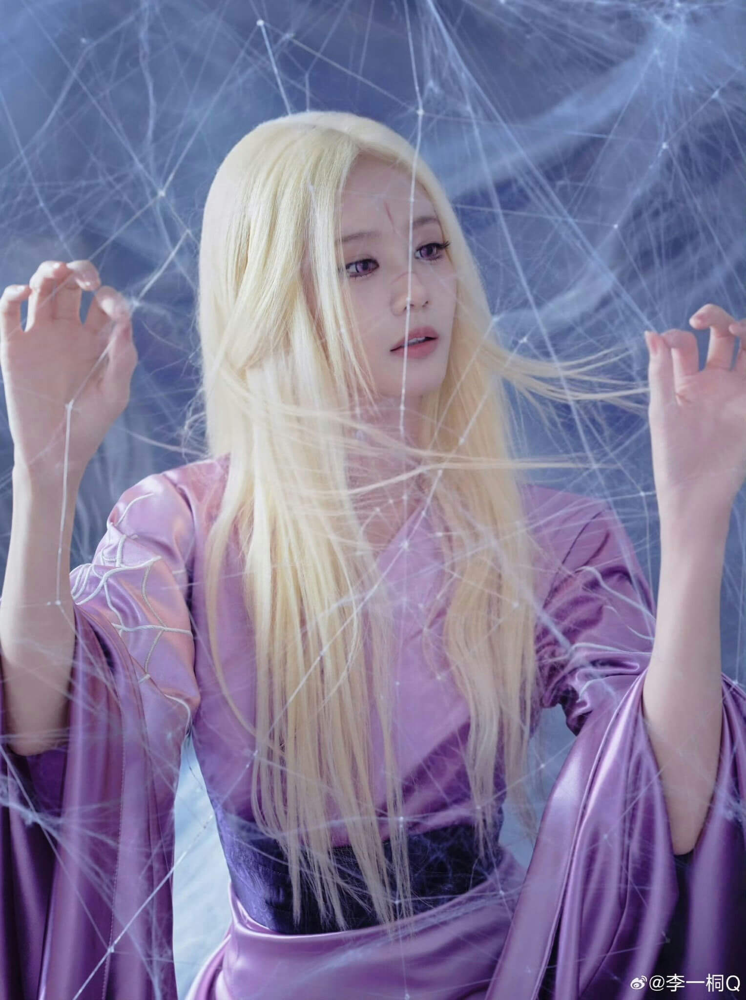 people-woman-blonde hair-purple attire-spiderweb effect-pale skin