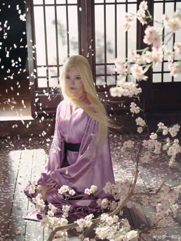 people-female cosplayer-A-blonde hair-A-purple kimono-A-cherry blossoms-A-indoor setting