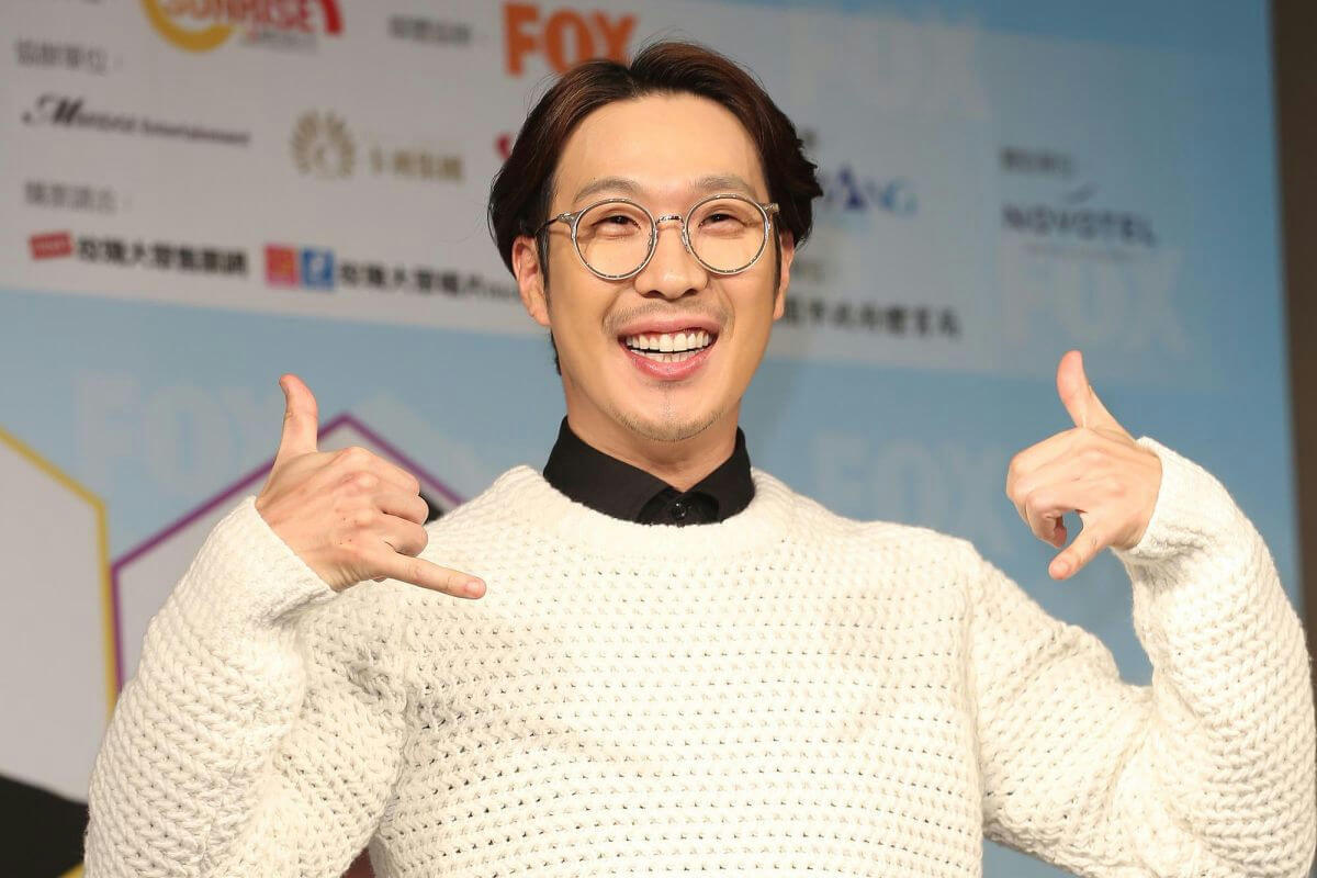 people-Asian man-A-smiling broadly-B-round glasses-C-white knitted sweater