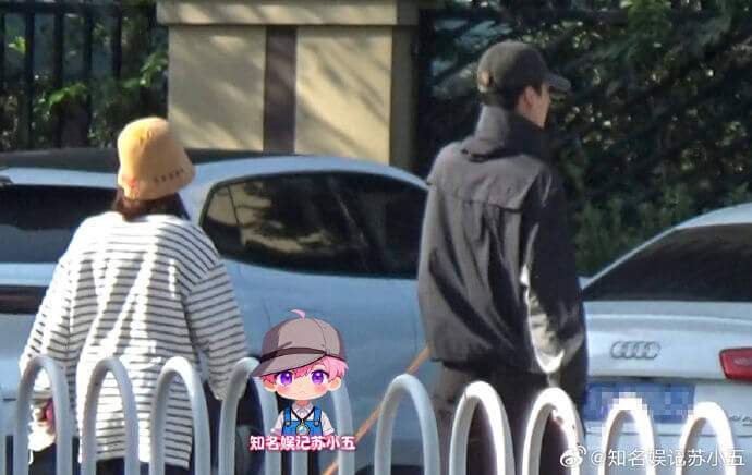 people-A-woman-A-striped shirt-A-yellow hat-B-man-B-dark jacket-B-baseball cap-C-outdoor scene-C-parked cars-C-bicycle rack
